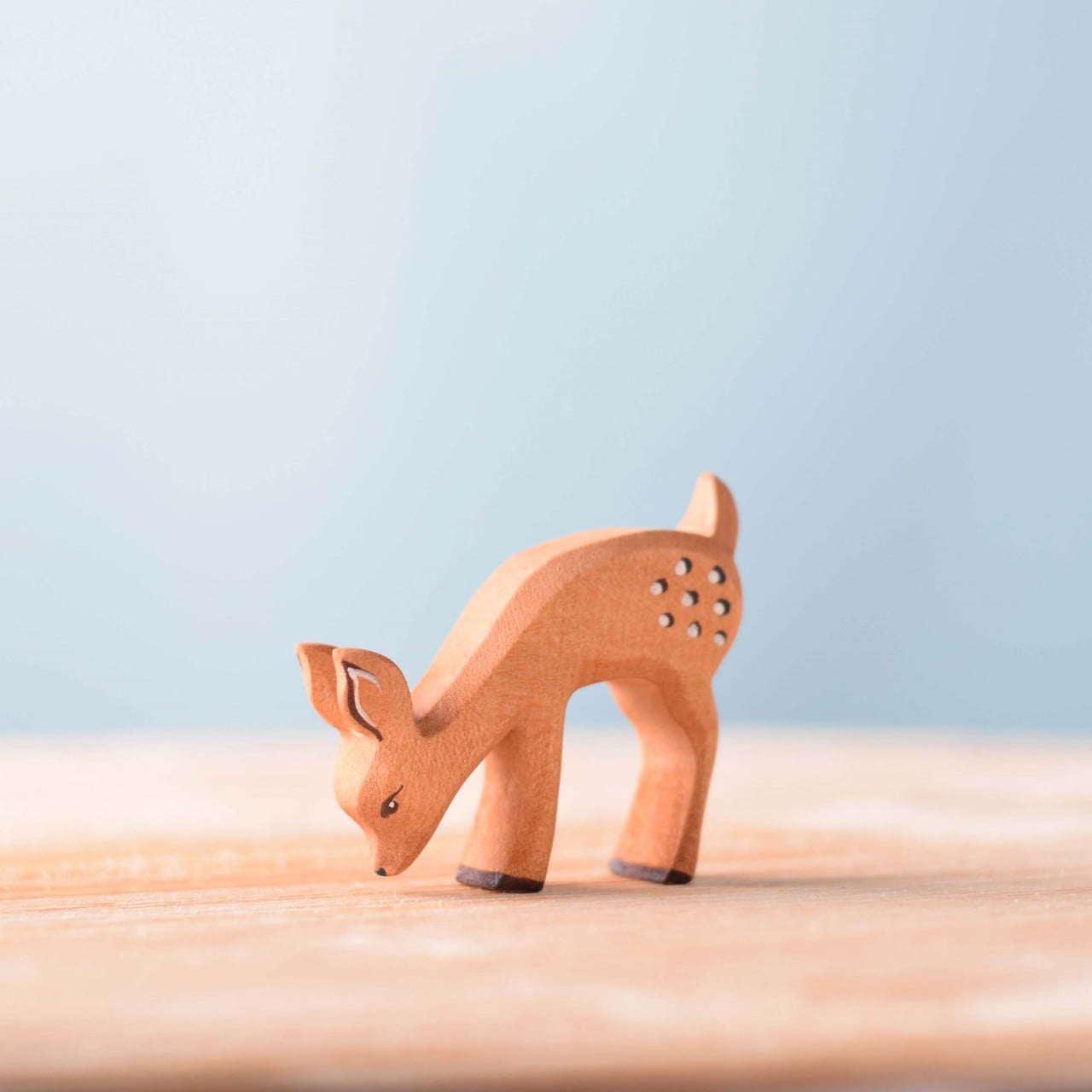 Wooden Fawn Eating