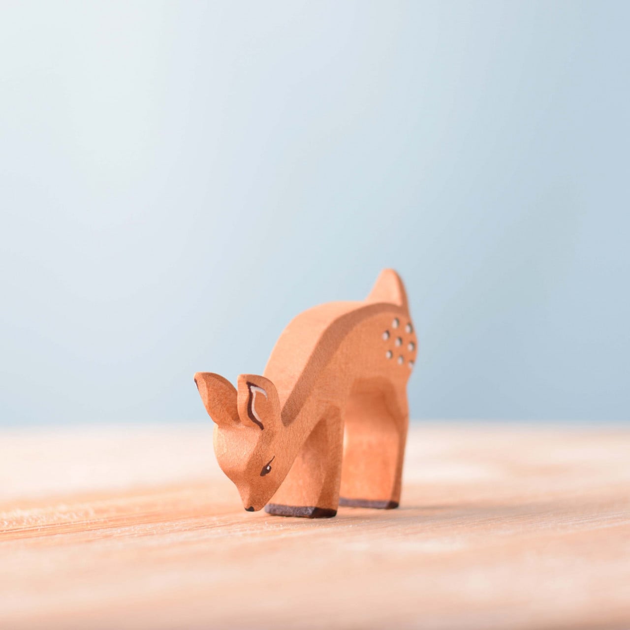 Wooden Fawn Eating